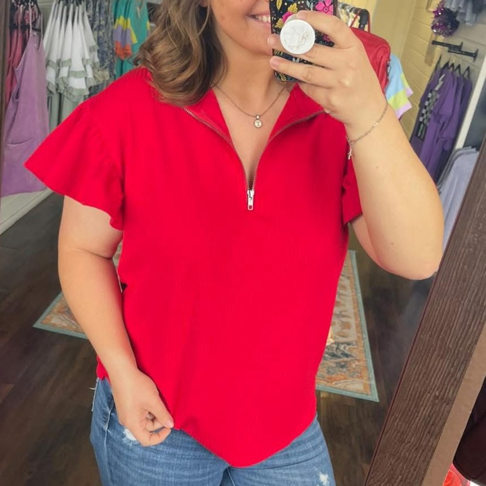 Red quarter zip top with ruffle sleeves